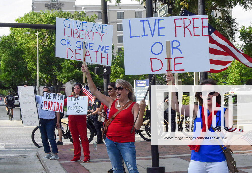 Protesters demonstrate outside the Orange County Administration Building demanding the end of stay-at-home orders and the reopening of Florida businesses as the COVID-19 pandemic keeps thousands of people in their homes and out of work. Orlando United States - ZUMAs197 20200417_zaa_s197_223