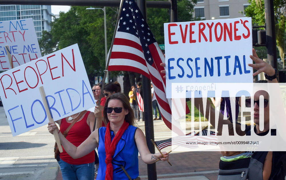 Protesters demonstrate outside the Orange County Administration Building demanding the end of stay-at-home orders and the reopening of Florida businesses as the COVID-19 pandemic keeps thousands of people in their homes and out of work. Orlando United States - ZUMAs197 20200417_zaa_s197_224
