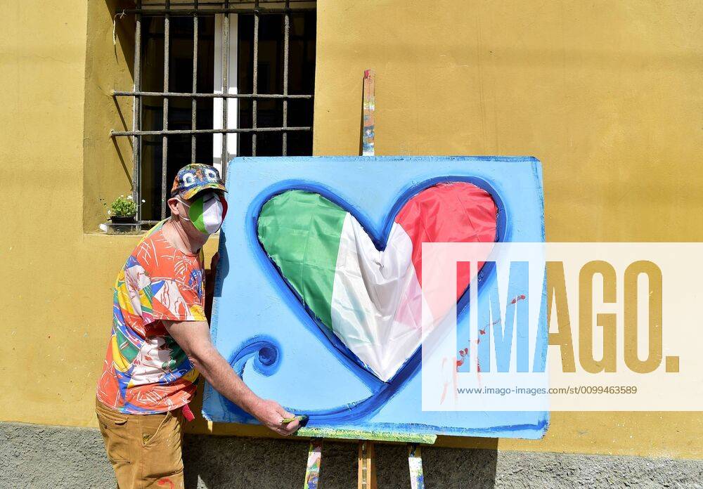 Milan, the painter Gregorio Mancino with his work a painting of a heart made with the Italian flag in the Naviglio Grande at the time of the coronavirus (Duilio Piaggesi Fotogramma, Milan - 2020-04-18) p.s. la foto e utilizzabile nel rispetto del contesto in cui e stata scattata, e senza intento diffamatorio del decoro delle persone rappresentate