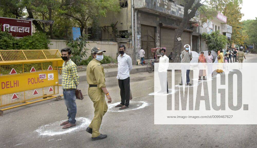 People queue to collect food distributed by the Delhi government during the lockdown, at Gandhi Nagar, on April 14, 2020 in New Delhi, India. (Photo by Sushil Kumar Hindustan Times ) Government And NGOs Provide Food To Homeless And Poor Amid Lockdown To Prevent Covid-19