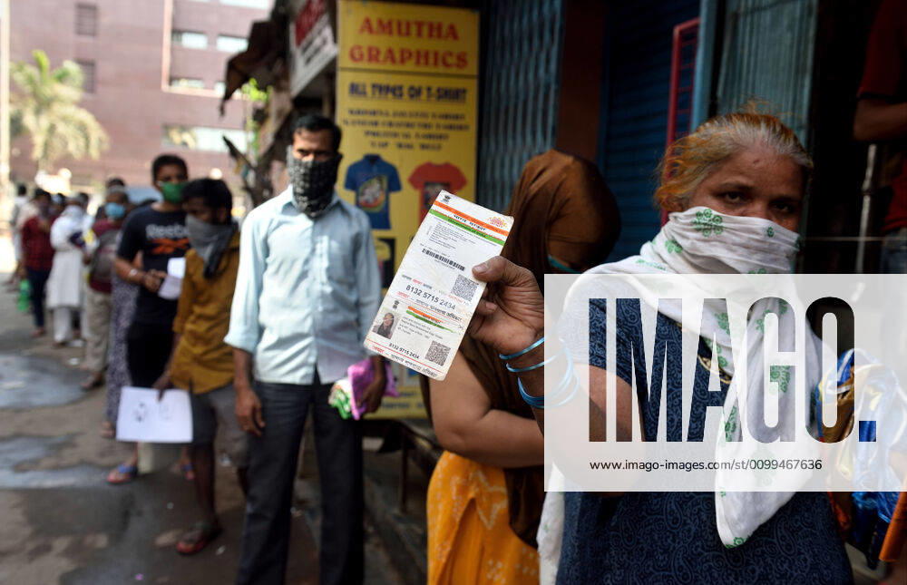 Residents of Dharavi lineup at rationing office for the food items, during the nationwide lockdown, imposed in the wake of the coronavirus pandemic, on April 14, 2020 in Mumbai, India. (Photo by Satish Bate Hindustan Times ) Government And NGOs Provide Food To Homeless And Poor Amid Lockdown To Prevent Covid-19