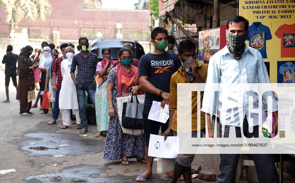 Residents of Dharavi lineup at rationing office for the food items, during the nationwide lockdown, imposed in the wake of the coronavirus pandemic, on April 14, 2020 in Mumbai, India. (Photo by Satish Bate Hindustan Times ) Government And NGOs Provide Food To Homeless And Poor Amid Lockdown To Prevent Covid-19