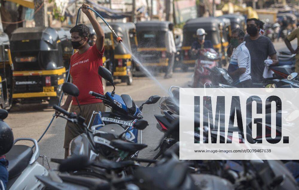 MUMBAI, INDIA APRIL 14: Residence of Juhu spray disinfectants, during the nationwide lockdown, imposed in the wake of the coronavirus pandemic at Juhu, on April 14, 2020 in Mumbai, India. (Photo by Satyabrata Tripathy Hindustan Times ) Sanitization Drive To Curb The Spread Of Coronavirus COVID-19