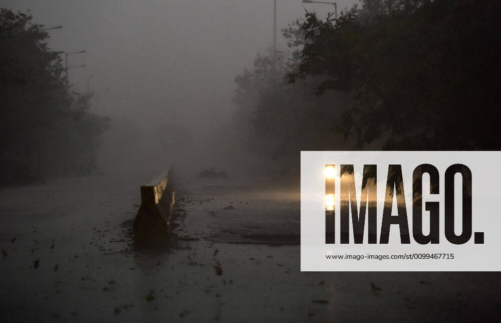 A car on the road at Sector 68, while it rains, on April 18, 2020 in Noida, India. (Photo by Virendra Singh Gosain Hindustan Times ) Heavy Rainfall In Delhi-NCR
