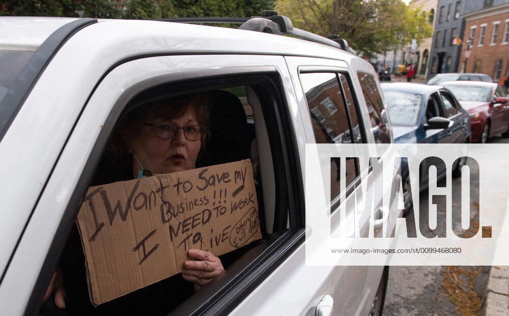 Drivers in vehicles line up during a protest to reopen Maryland and end the stay at home order imposed during the Coronavirus COVID-19 pandemic, near the state capitol building in Annapolis, Maryland on Saturday, April 18, 2020. Drivers circled Annapolis hoking their horns and calling for Gov. Larry Hogan (R-MD) to end the stay at home order. WAP20200418319 KEVINxDIETSCH