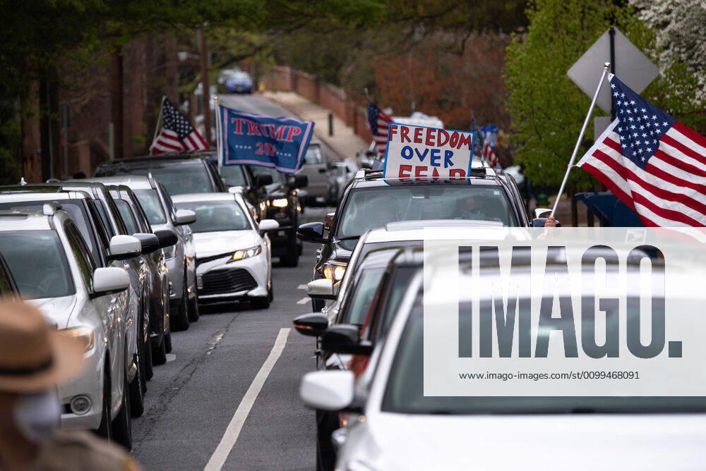 Drivers in vehicles participate in a car protest to reopen Maryland and end the stay at home order imposed during the Coronavirus COVID-19 pandemic, near the state capitol building in Annapolis, Maryland on Saturday, April 18, 2020. Drivers circled Annapolis hoking their horns and calling for Gov. Larry Hogan (R-MD) to end the stay at home order. WAP20200418327 KEVINxDIETSCH