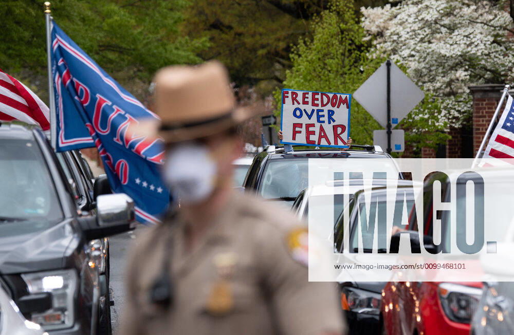 Drivers in vehicle participate in a car protest to reopen Maryland and end the stay at home order imposed during the Coronavirus COVID-19 pandemic, near the state capitol building in Annapolis, Maryland on Saturday, April 18, 2020. Drivers circled Annapolis hoking their horns and calling for Gov. Larry Hogan (R-MD) to end the stay at home order. WAP20200418333 KEVINxDIETSCH