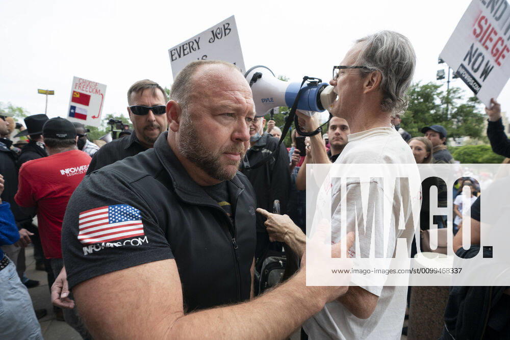 Alex Jones works his way through the crowd as a few hundred Texans flaunt social distancing guidlines in an InfoWars inspired rally at the Texas Capitol where founder Jones encourages the crowd with right-wing rhetoric. Gov. Greg Abbott announced Friday relaxed restrictions on business starting next week. Austin USA - ZUMAd150 20200418_znp_d150_004