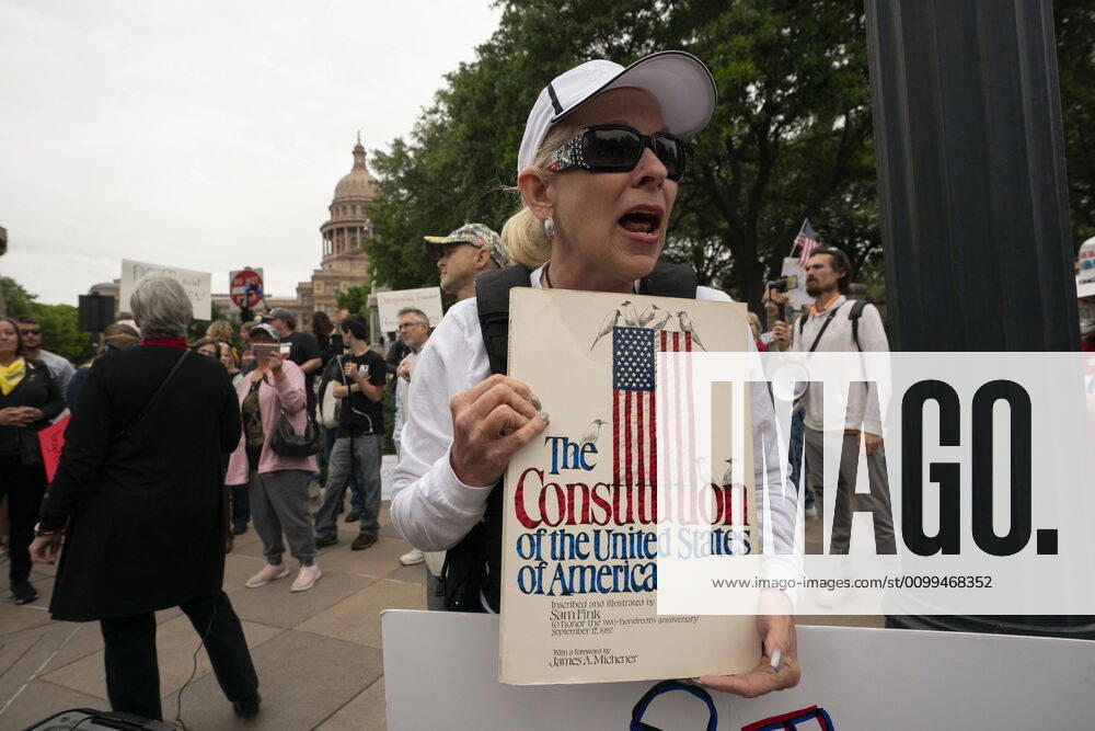 Claudia Cuchia of Austin speaks to the crowd as a few hundred Texans flaunt social distancing guidelines in an InfoWars inspired rally at the Texas Capitol where founder Alex Jones encourages the crowd with right-wing rhetoric. Gov. Greg Abbott announced Friday relaxed restrictions on business starting next week. Austin USA - ZUMAd150 20200418_znp_d150_019
