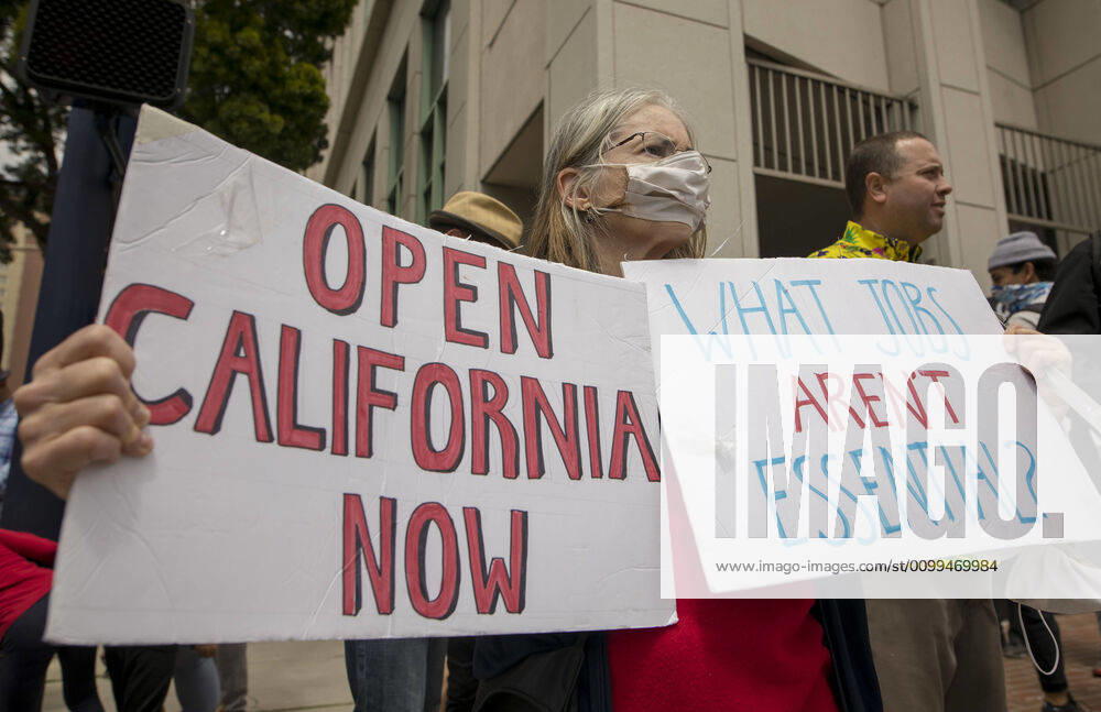 Protesters at a Liberate San Diego rally in downtown San Diego on Saturday waved signs and held banners complaining that they wanted the state to lift its stay at home order, a measure meant to reduce the spread of the coronavirus. The event was clearly political, with an overwhelming amount of signs and banners supporting President Trump. San Diego US - ZUMAp23_ 20200418_zaf_p23_004