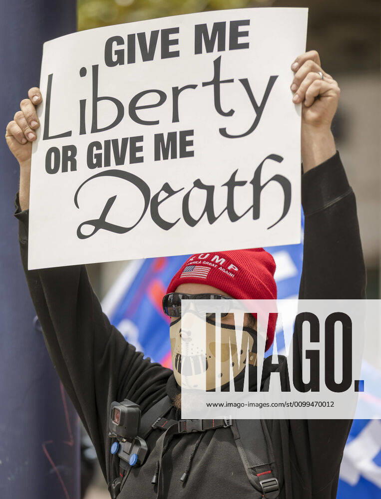 Protesters at a Liberate San Diego rally in downtown San Diego on Saturday waved signs and held banners complaining that they wanted the state to lift its stay at home order, a measure meant to reduce the spread of the coronavirus. The event was clearly political, with an overwhelming amount of signs and banners supporting President Trump. San Diego US - ZUMAp23_ 20200418_zaf_p23_030