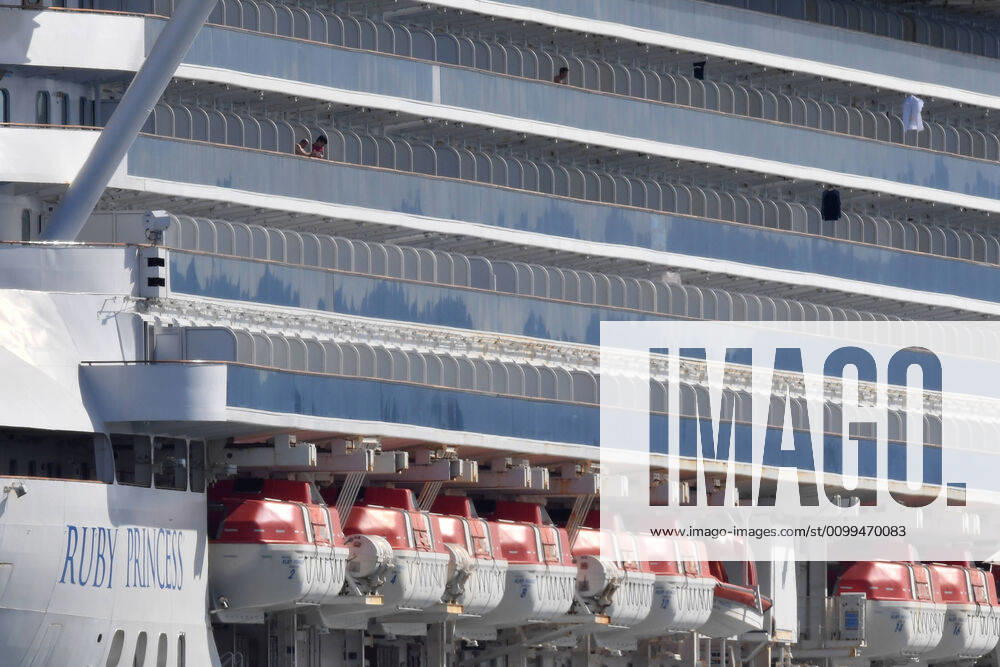 RUBY PRINCESS DEPARTURE, Crew can be seen on the Ruby Princess cruise which remains docked at Port Kembla, Wollongong, Sunday, April 19, 2020. A criminal investigation has been launched into how cruise line operator Carnival Australia was allowed to disembark Ruby Princess passengers in Sydney, resulting in several deaths and COVID-19 outbreaks throughout the country. The Ruby Princess was due to depart Port Kembla today. ( NO ARCHIVING, , NO USE IN BOOKS WITHOUT CONSENT WOLLONGONG NSW AUSTRALIA