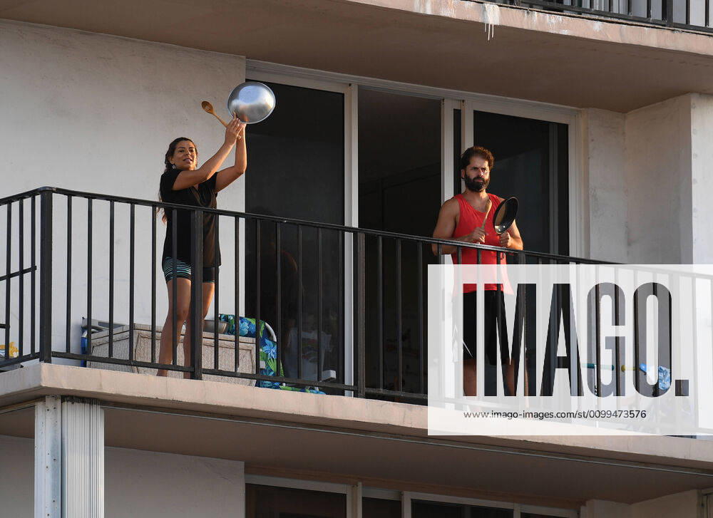 POMPANO BEACH, FL - APRIL 18: A general view of people on their balconies paying tribute to Healthcare workers and first responders at 7:00 PM as South Florida Beaches remain closed during the Coronavirus (COVID-19) pandemic on April 18, 2020 in Pompano Beach, Florida.