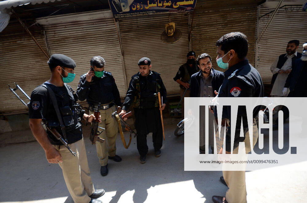 Pakistan: Police officials closing shops General view shows police officials closing shops in the city for precautionary measures to prevent corona virus. Peshawar khyber pakhtunkhwa Pakistan