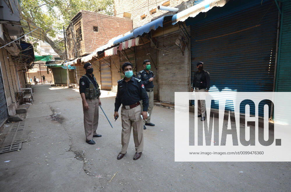 Pakistan: Police officials closing shops General view shows police officials closing shops in the city for precautionary measures to prevent corona virus. Peshawar khyber pakhtunkhwa Pakistan