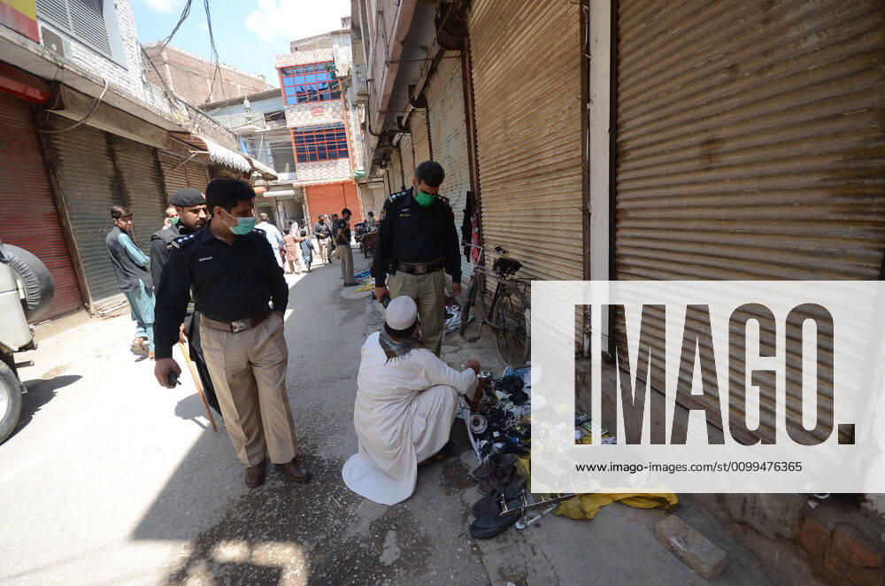 Pakistan: Police officials closing shops General view shows police officials closing shops in the city for precautionary measures to prevent corona virus. Peshawar khyber pakhtunkhwa Pakistan