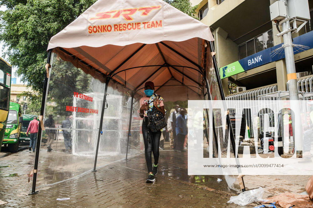 A passenger walks through a sanitiser spray booth that disinfects the whole body at Kencom Bus Stop before boarding public transport to their various destinations as a preventive measure against the spread of Coronavirus..President Uhuru Kenyatta on March 25, 2020 imposed a dusk-to-dawn 21 day curfew from (7pm-5am) that took effect on Friday, March 26, 2020 in order to curb the spread of COVID-19. Kenya has so far recorded 270 cases of the Coronavirus, 67 recoveries and 14 deaths. Nairobi Kenya - ZUMAs197 20200419_zaa_s197_059