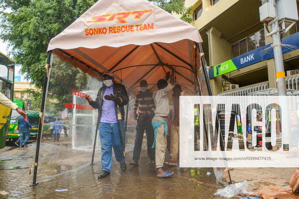 Passengers pass through a sanitiser spray booth that disinfects the whole body at Kencom Bus Stop before boarding public transport to their various destinations as a preventive measure against the spread of Coronavirus..President Uhuru Kenyatta on March 25, 2020 imposed a dusk-to-dawn 21 day curfew from (7pm-5am) that took effect on Friday, March 26, 2020 in order to curb the spread of COVID-19. Kenya has so far recorded 270 cases of the Coronavirus, 67 recoveries and 14 deaths. Nairobi Kenya - ZUMAs197 20200419_zaa_s197_060