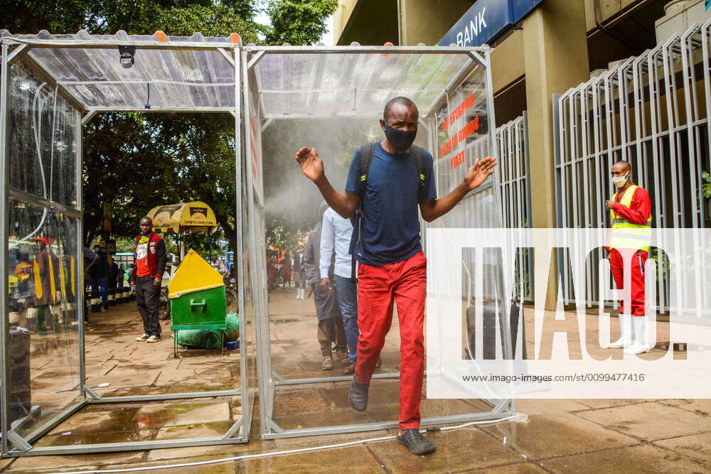 Passengers pass through a sanitiser spray booth that disinfects the whole body at Kencom Bus Stop before boarding public transport to their various destinations as a preventive measure against the spread of Coronavirus..President Uhuru Kenyatta on March 25, 2020 imposed a dusk-to-dawn 21 day curfew from (7pm-5am) that took effect on Friday, March 26, 2020 in order to curb the spread of COVID-19. Kenya has so far recorded 270 cases of the Coronavirus, 67 recoveries and 14 deaths. Nairobi Kenya - ZUMAs197 20200419_zaa_s197_061
