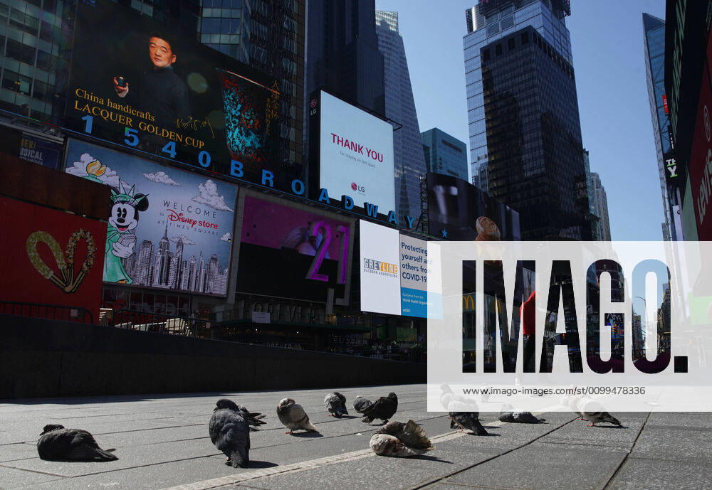 A pedestrian wearing a protective face walks in a nearly empty of pedestrian and automobile traffic Times Square on Easter Sunday of Orthodox Easter weekend in New York City on Sunday, April 19, 2020. The world s Orthodox Christians are celebrating Easter through a series of restrictions and bans including closures of churches due to the Coronavirus pandemic. More than 13,300 people with COVID-19 have died in New York State. NYP20200419110 JOHNxANGELILLO