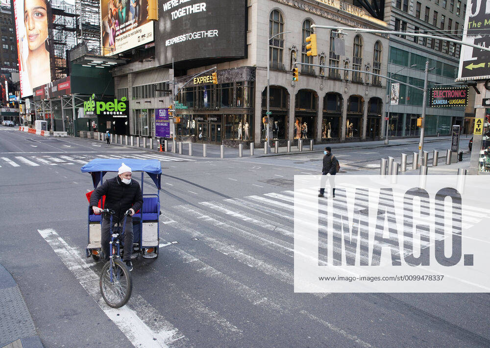 A pedestrian and a man riding a rickshaw occupy a crosswalk on 7th Avenue in a nearly empty of pedestrian and automobile traffic Times Square on Easter Sunday of Orthodox Easter weekend in New York City on Sunday, April 19, 2020. The world s Orthodox Christians are celebrating Easter through a series of restrictions and bans including closures of churches due to the Coronavirus pandemic. More than 13,300 people with COVID-19 have died in New York State. NYP20200419115 JOHNxANGELILLO