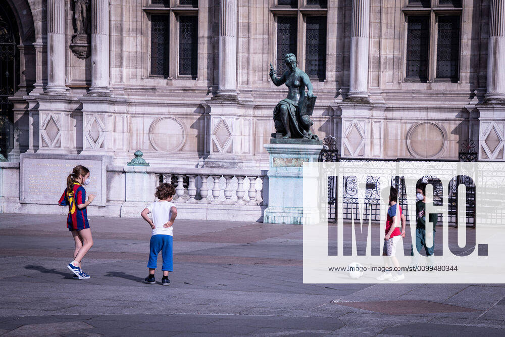 Children play football while wearing face masks at the forecourt of Paris City Hall during the quarantine..France has recorded 112606 confirmed cases, 36578 recovered and 19718 deaths by the corona virus. Paris France - ZUMAs197 20200419_zaa_s197_090