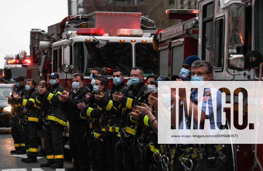 New York firemen clap for health care workers fighting the coronovirus Sunday at 7pm, in front of the Langone Hospital, in what has become a nightly ritual all over the city, as the number of deaths from the coronavirus topped 13,000, even as the overall numbers of hospitalizations, intubations and deaths from Covid 19 continued to drop, suggesting the state could be turning a corner in its fight against the pandemic. New York United States - ZUMAl113 20200419_zap_l113_001
