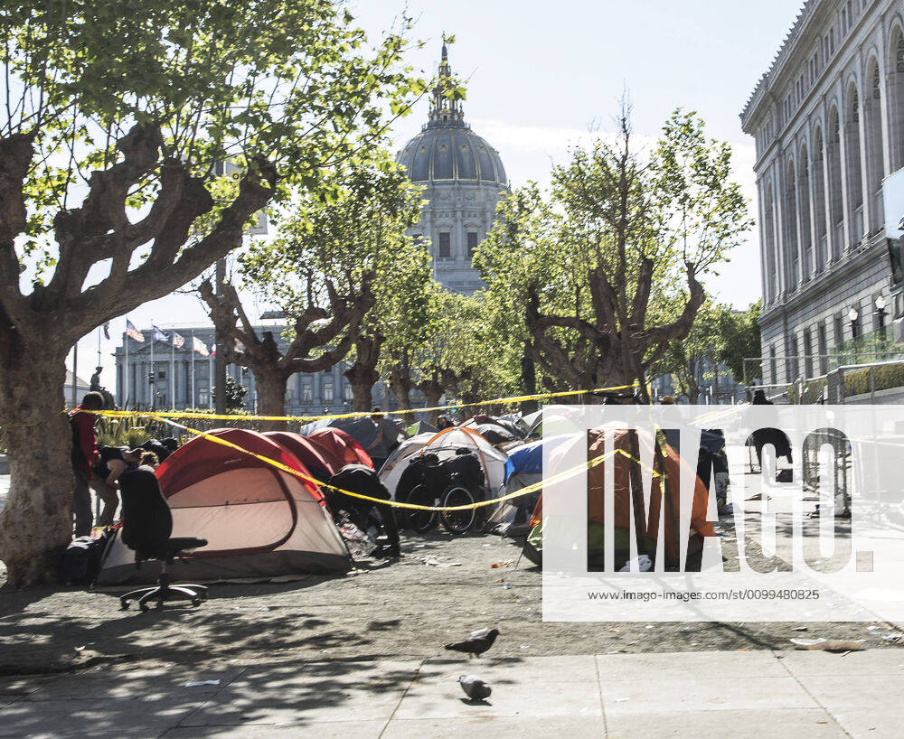A homeless encampment next to the main library sits in view of City Hall in San Francisco on Sunday, April 19, 2020. San Francisco Mayor London Breed says that efective now, face masks must be worn outside the home to protect against coronavirus. SXP2020041913 TERRYxSCHMITT