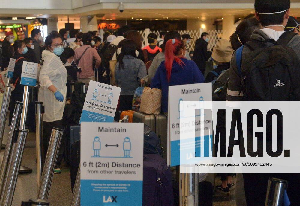 Hundreds of passengers form a line to check-in and board a China Southern Airlines midnight flight to China on Sunday, April 19, 2020 in Los Angeles. Passengers at the front of the line arrived at 5:30 a.m., with many others standing in line since 8 a.m. to ensure they would have a seat before the plane was full. Mayor Eric Garcetti said 95% of air travel has stopped in his city as Los Angeles sees the biggest drop of airplane travel in LAX history. LAP2020041912 JIMxRUYMEN