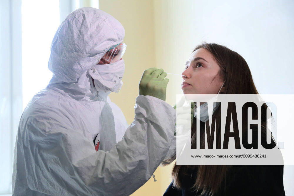 An employee demonstrates sample collection for COVID-19 testing at an infectious diseases center opened at a high-tech surgery unit of the National Medical Research Center for Children s Health of the Russian Healthcare Ministry. Having the bed capacity of 300, with 30 beds in an intensive care unit and 8 operating rooms, the center will admit patients with suspected COVID-19 coronavirus infection. Sergei Savostyanov TASS TS0D66D6