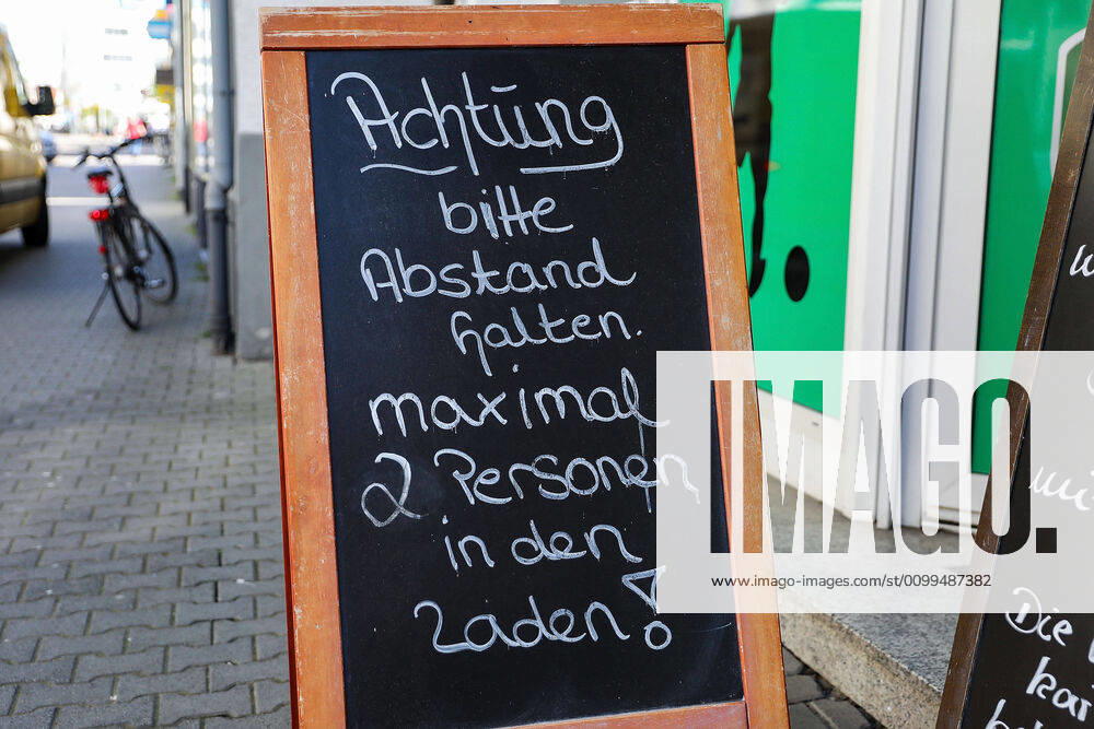Coronavirus, opening of the first shops from the entrance sign, customers, Langen Hessen Germany DE