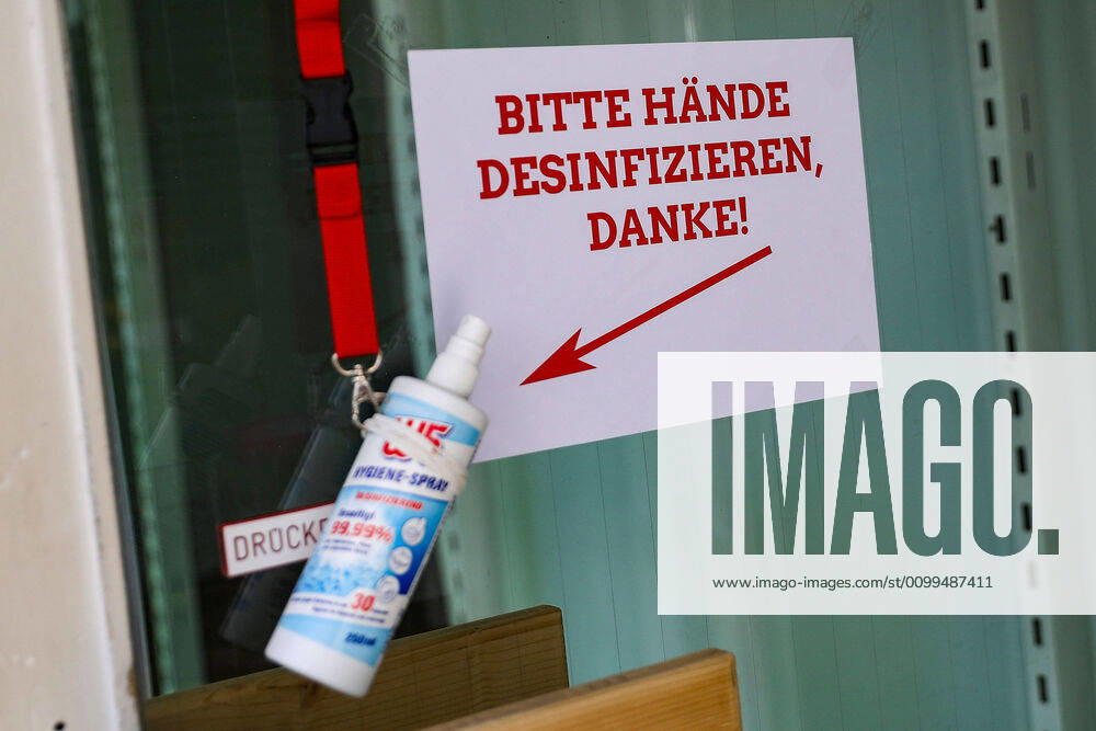 coronavirus, opening of the first shops v l entrance, disinfecting hands, disinfectant, symbol image, Langen Hessen Germany EN