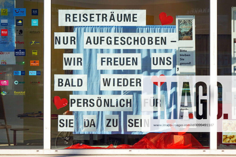 Berlin,Germany,GER,the city in times of the Corona Pandemic Notice in a travel agency in the Kantstrasse in the district Charlottenburg Travel dreams only postponed we are looking forward to be there for you again soon