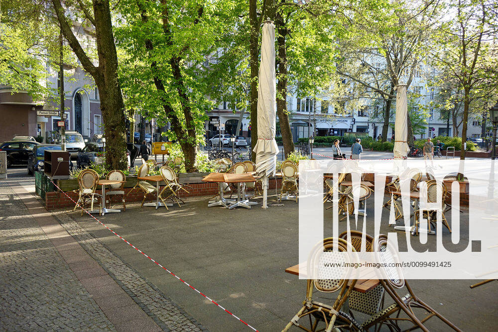 Berlin,Germany,GER,the city at the time of the corona pandemic Ludwigkirchplatz, numerous chairs waiting for customers