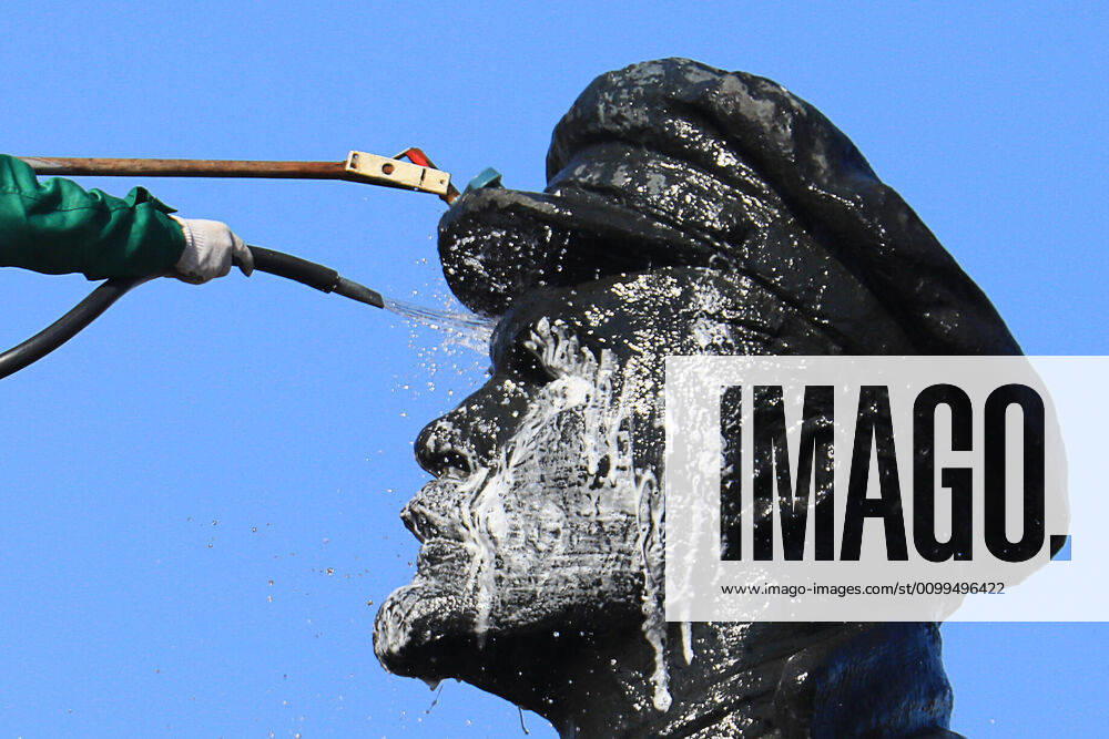 Utility workers washing a monument to Russian revolutionary Vladimir Lenin. Andrei Samsonov TASS TS0D67D0