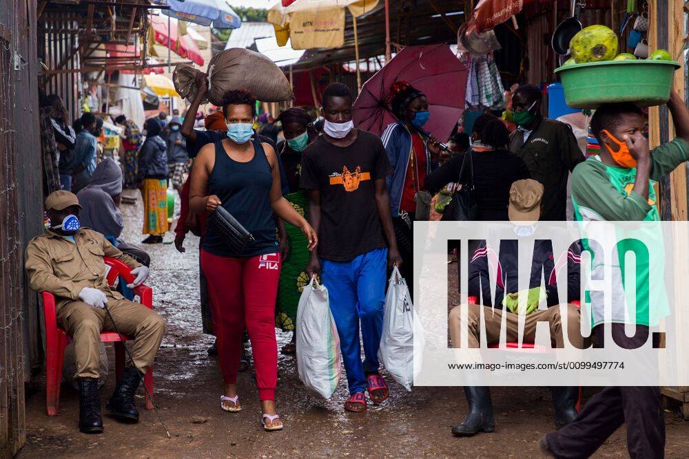 (200421) -- KIGALI, April 21, 2020 -- People are seen wearing face masks while leaving a market in Kigali, capital city of Rwanda, on April 20, 2020. Rwandan health minister on Saturday called on the public to embrace wearing of face masks while moving in public places and staying at home as part of the efforts to contain COVID-19. (Photo by Xinhua) RWANDA-KIGALI-COVID-19 CyrilxNdegeya