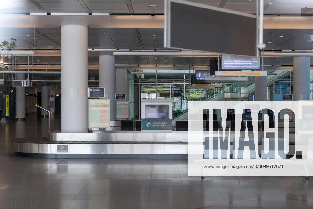 Effects Corona Munich Airport In the picture View into the arrivals hall Terminal 2 Baggage carousels left empty no one refers Munich Munich Airport Munich Bavaria Germany