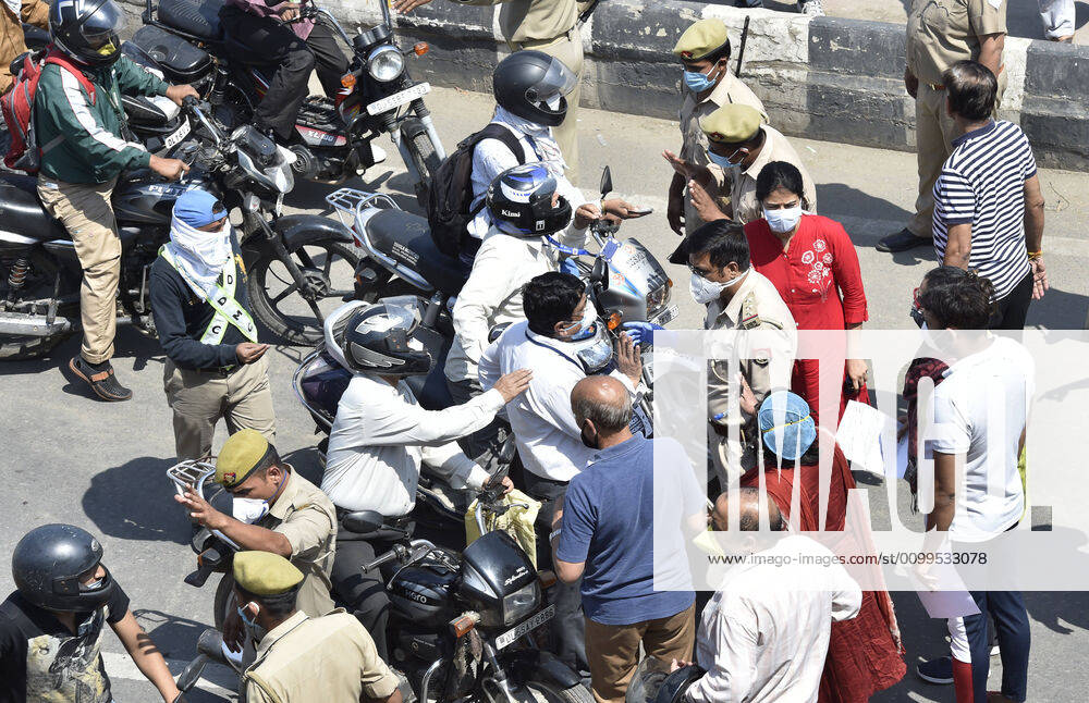 People show their papers to police personnel for passage at the Delhi-UP border in Ghazipur which was stopped by Ghaziabad administration during lockdown against coronavirus on April 21, 2020 in New Delhi, India. The orders to seal the Ghaziabad borders were issued by District Magistrate Ajay Shankar Pandey on Monday, but many people were unaware of the directive. The decision was taken after six people who had come from Delhi tested positive for coronavirus, said Pandey in an order issued on April 20. (Photo by Ajay Aggarwal Hindustan Times) Major Traffic Jam As Delhi-Ghaziabad Border Shut By District Magistrate To Stop Covid-19 Spread