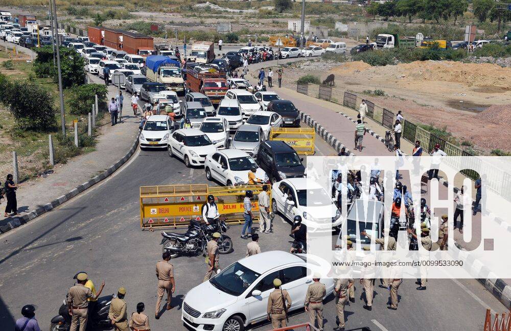 A heavy traffic jam at the Delhi-UP border in Ghazipur due to passage for commuters being stopped by Ghaziabad administration during lockdown against coronavirus on April 21, 2020 in New Delhi, India. The orders to seal the Ghaziabad borders were issued by District Magistrate Ajay Shankar Pandey on Monday, but many people were unaware of the directive. The decision was taken after six people who had come from Delhi tested positive for coronavirus, said Pandey in an order issued on April 20. (Photo by Ajay Aggarwal Hindustan Times) Major Traffic Jam As Delhi-Ghaziabad Border Shut By District Magistrate To Stop Covid-19 Spread