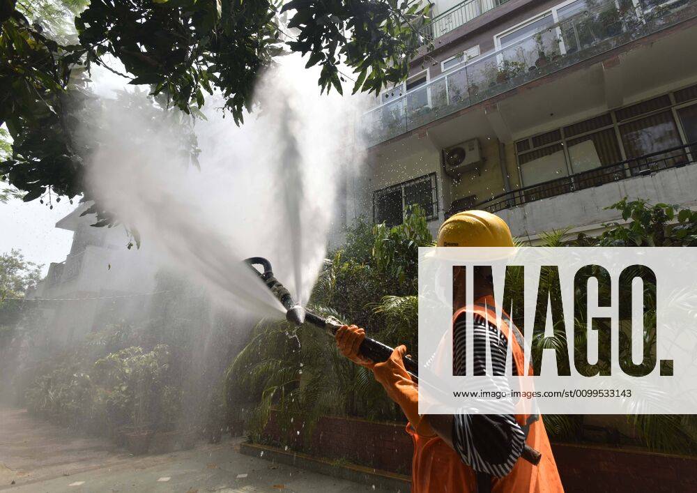 An Delhi Jal Board (DJB) worker chemically disinfects a house in Vasant Kunj during lockdown to curb the spread of coronavirus, on April 21, 2020 in New Delhi, India. (Photo by Sanjeev Verma Hindustan Times) Sanitization Drive To Curb The Spread Of Coronavirus COVID-19