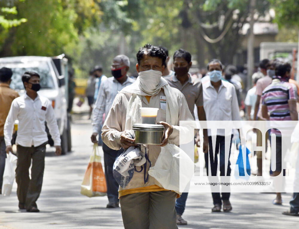 People queue to collect food distributed by BJP councilor Shikha Rai during lockdown to curb spread of coronavirus, at Shahpur Jat, on April 21, 2020 in New Delhi, India. (Photo by Sanjeev Verma Hindustan Times) Government And NGOs Provide Food To Homeless And Poor Amid Lockdown To Prevent Covid-19 Pandemic
