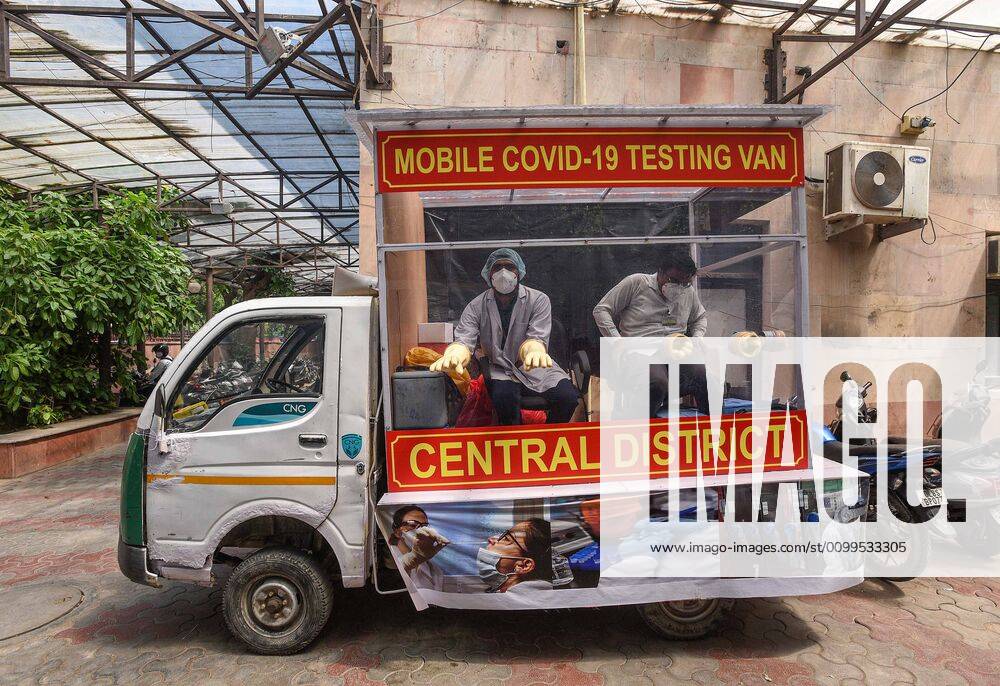 Health workers in a mobile testing van prepare to take swab samples from residents of the Hauz Qazi area for COVID-19 antibody rapid testing as a precautionary measure, at SDM office in Daryaganj during lockdown on April 21, 2020 in New Delhi, India. (Photo by Biplov Bhuyan Hindustan Times) Antibody Rapid Testing In Delhi In View Of Covid-19 Pandemic