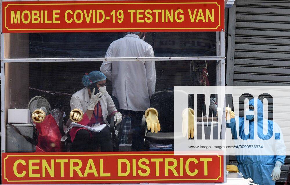 Health workers in a mobile testing van before taking swab samples from residents of the Hauz Qazi area for COVID-19 antibody rapid testing as a precautionary measure during lockdown on April 21, 2020 in New Delhi, India. (Photo by Biplov Bhuyan Hindustan Times) Antibody Rapid Testing In Delhi In View Of Covid-19 Pandemic