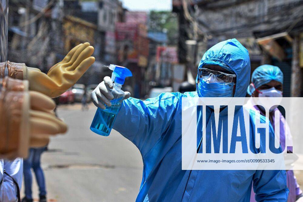 A health worker sanitizes a mobile testing van used for taking swab samples from residents of the Hauz Qazi area for COVID-19 antibody rapid testing as a precautionary measure during lockdown on April 21, 2020 in New Delhi, India. (Photo by Biplov Bhuyan Hindustan Times) Antibody Rapid Testing In Delhi In View Of Covid-19 Pandemic