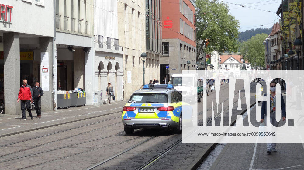 Freiburg Themed picture medicine A police car patrols through Freiburgs city centre The long and silent way back to everyday life Like here in Freiburg life starts pulsating again Themed picture medicine Coronavirus