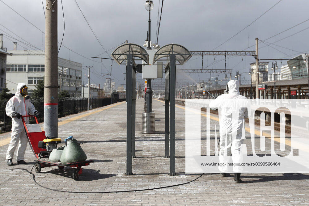 Emercom workers in protective suits wash a platform with disinfectant at Kiyevsky railway station amid the ongoing COVID-19 pandemic. Sergei Fadeichev TASS TS0D6A37