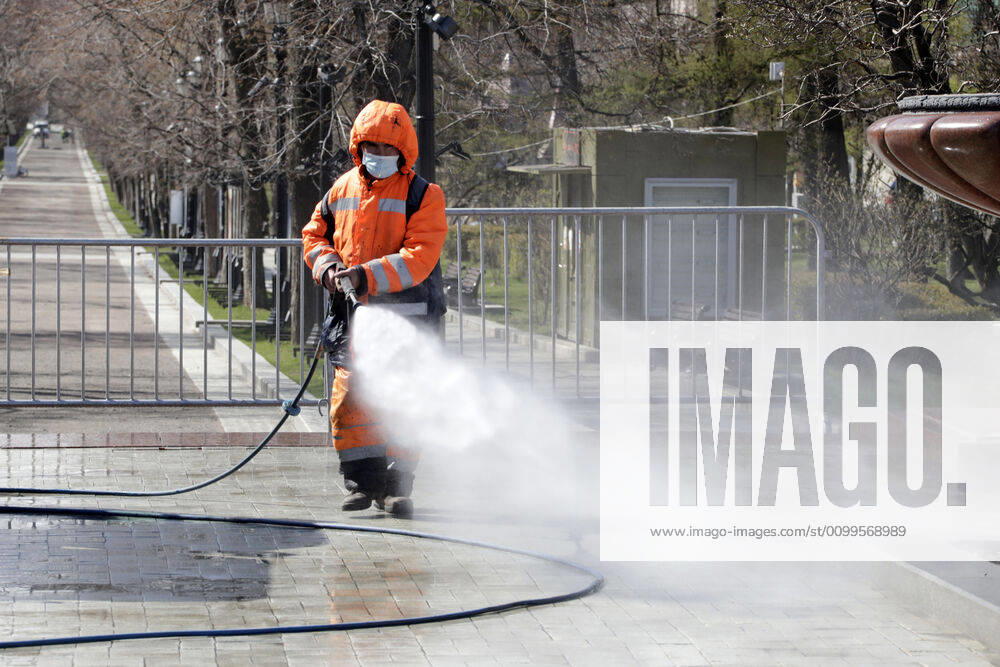 A utility worker carries out disinfection procedures on Tverskoy Boulevard amid the ongoing COVID-19 pandemic; the Russian government has extended a paid period off work until April 30 nationwide to counter the spread of the COVID-19 infection. Mikhail Metzel TASS TS0D6A41