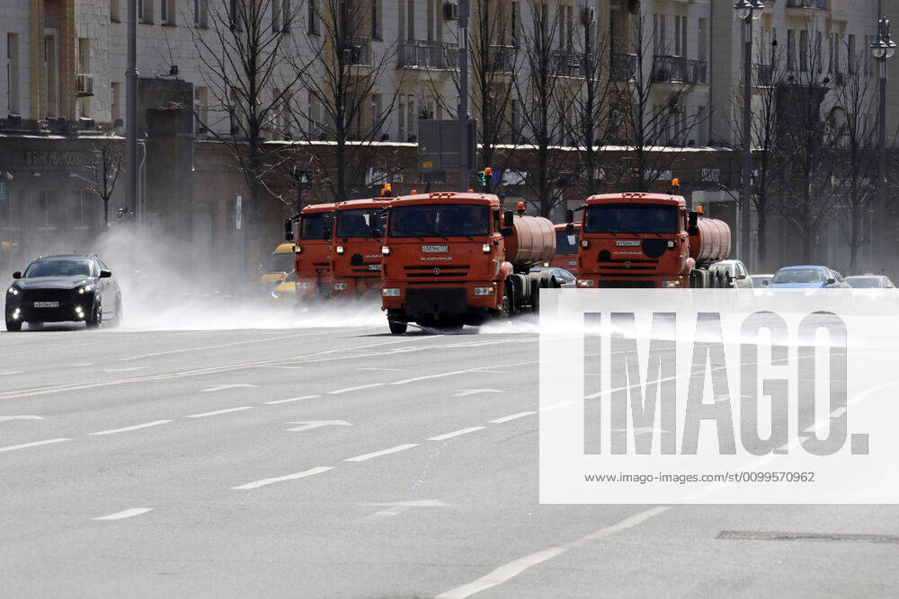 Trucks wash the road with disinfectant on Tverskaya Street amid the ongoing COVID-19 pandemic; the Russian government has extended a paid period off work until April 30 nationwide to counter the spread of the COVID-19 infection. Mikhail Metzel TASS TS0D6A44