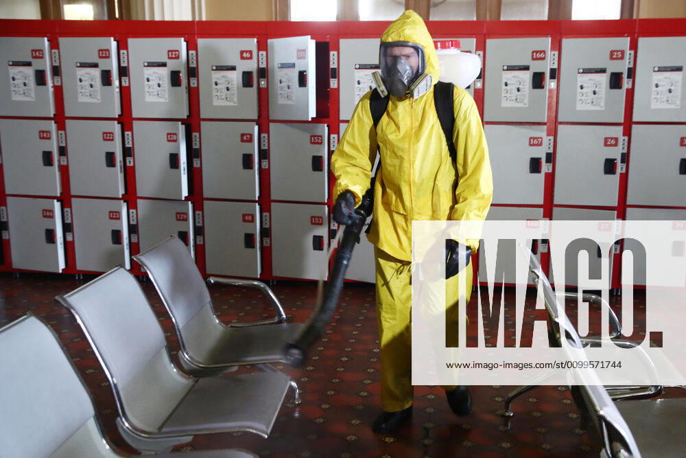 An Emercom worker in a protective suit carries out disinfection procedures at Kiyevsky railway station amid the ongoing COVID-19 pandemic. Sergei Fadeichev TASS TS0D6A4A
