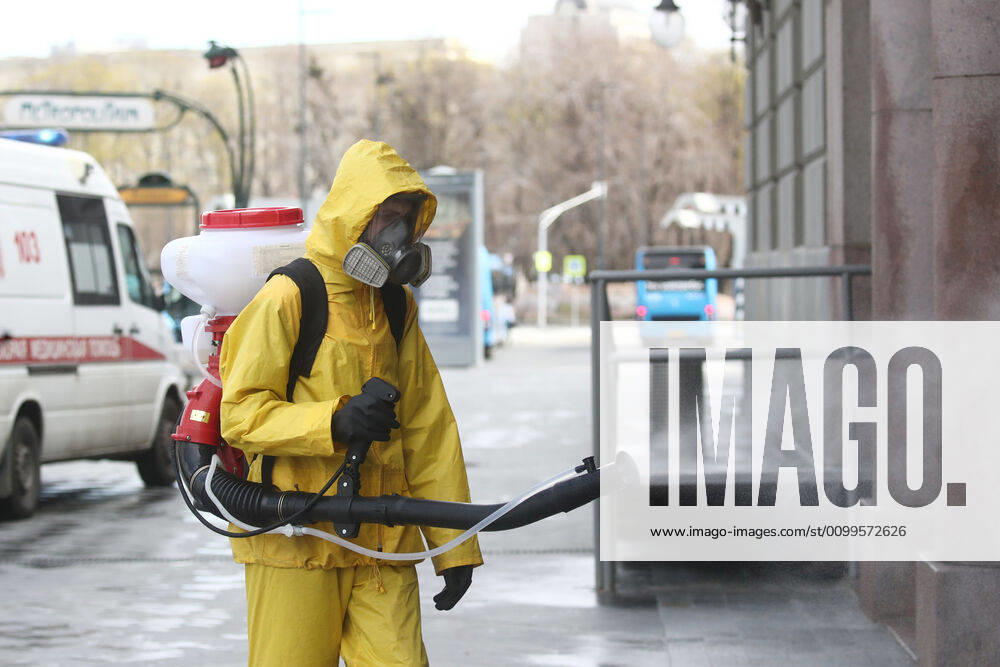 An Emercom worker in a protective suit carries out disinfection procedures outside Kiyevsky railway station amid the ongoing COVID-19 pandemic. Sergei Fadeichev TASS TS0D6A6A